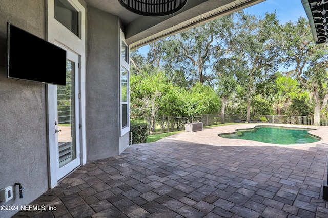 view of swimming pool with a patio