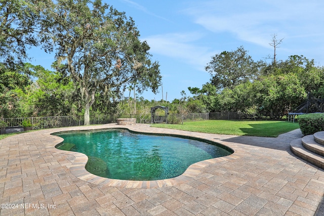 view of pool featuring a patio and a lawn