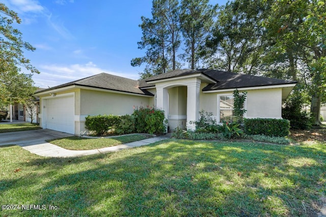 4021 Savannah Glen Blvd, Orange Park, FL 32073 - ranch-style home featuring an attached garage, stucco siding, concrete driveway, a front yard, and roof with shingles