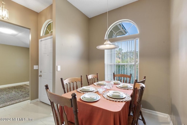 dining space with light tile patterned floors