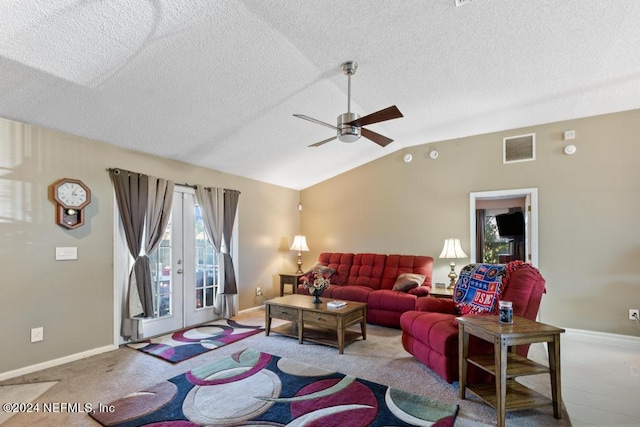 carpeted living room featuring lofted ceiling, french doors, a textured ceiling, and ceiling fan