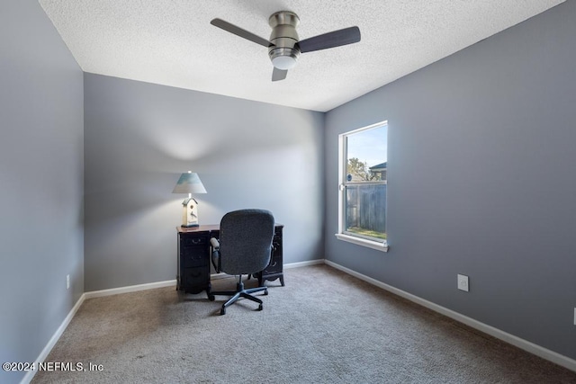 home office with carpet, a textured ceiling, and ceiling fan