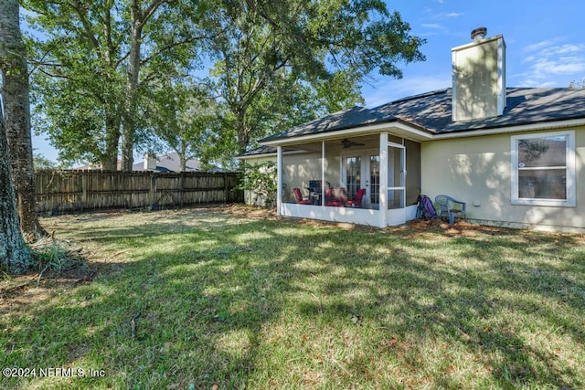 4021 Savannah Glen Blvd, Orange Park, FL 32073 - rear view of house featuring a yard, a sunroom, ceiling fan, and a fenced backyard