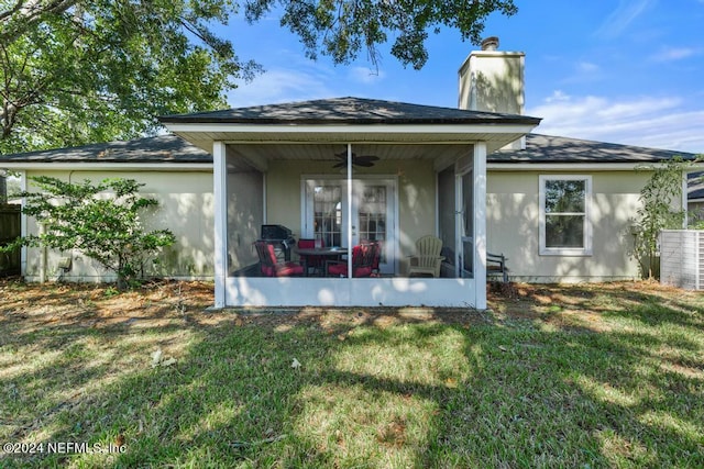 back of property featuring central AC, a yard, and ceiling fan