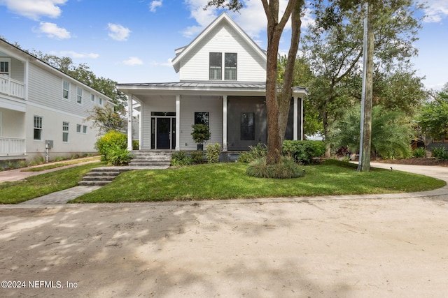 view of front of home with a front lawn and covered porch