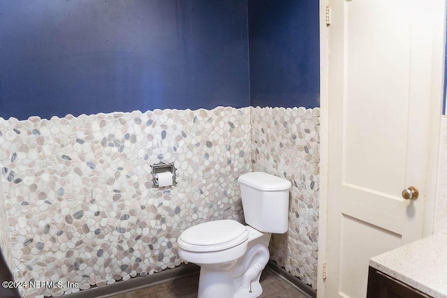 762 N Walnut St, Starke, FL 32091 - half bathroom featuring toilet and wood finished floors