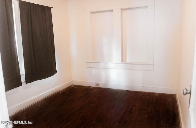 762 N Walnut St, Starke, FL 32091 - spare room featuring wood-type flooring and baseboards