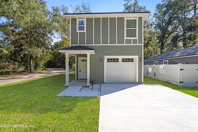 view of front facade with a front lawn and a garage