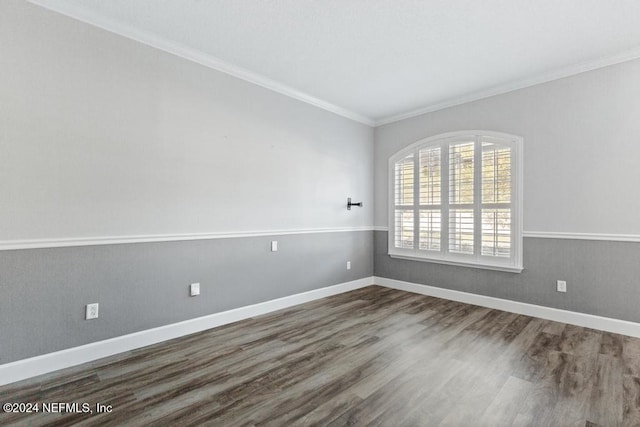 unfurnished room with dark hardwood / wood-style flooring and crown molding