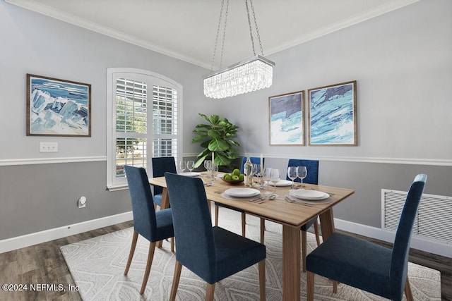 dining space featuring a notable chandelier, dark hardwood / wood-style floors, and crown molding