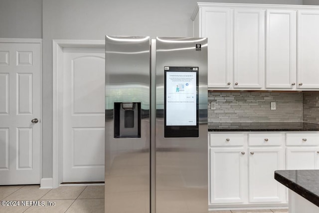 kitchen featuring white cabinetry, stainless steel fridge with ice dispenser, and light tile patterned floors