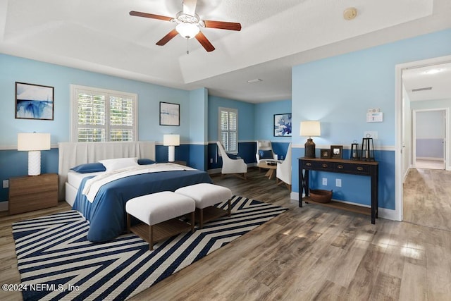 bedroom featuring hardwood / wood-style flooring and ceiling fan