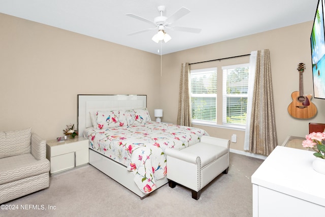 bedroom with ceiling fan and carpet flooring