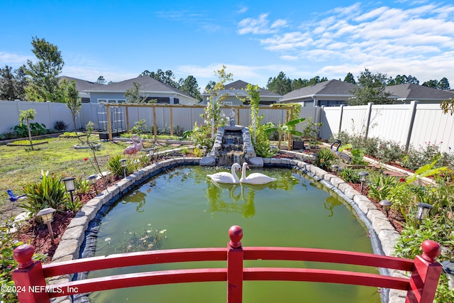 exterior space with a small pond