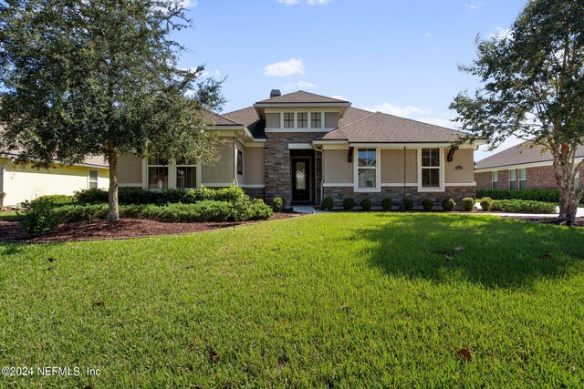 3605 Oglebay Dr, Green Cove Springs, FL 32043 - prairie-style home featuring a front lawn, stone siding, and stucco siding