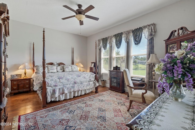 bedroom featuring ceiling fan and hardwood / wood-style flooring