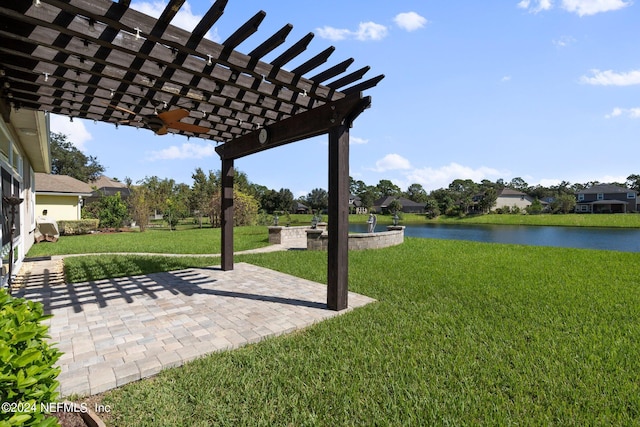 view of yard featuring a water view, a patio area, and a pergola