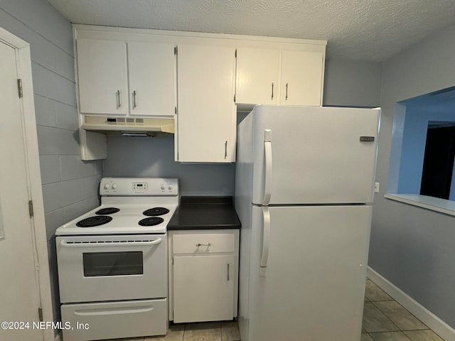 kitchen featuring white cabinetry, a textured ceiling, light tile patterned floors, and white appliances