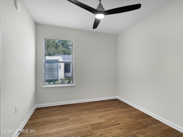 unfurnished room featuring ceiling fan, hardwood / wood-style flooring, and a textured ceiling