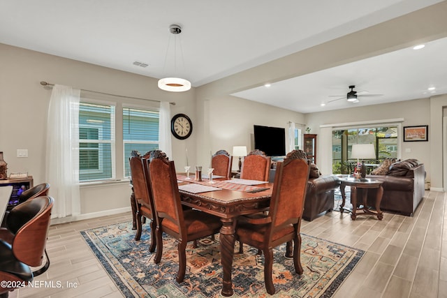 dining space featuring light hardwood / wood-style floors, ceiling fan, and a healthy amount of sunlight