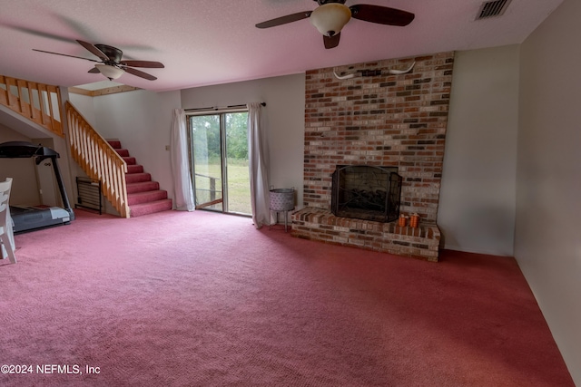 unfurnished living room with carpet flooring, ceiling fan, and a brick fireplace