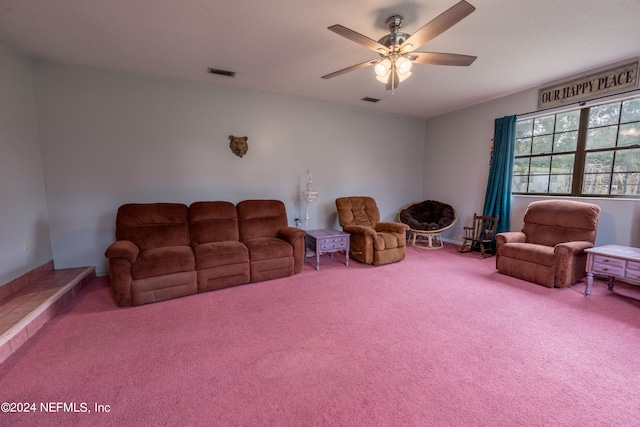 carpeted living room with ceiling fan