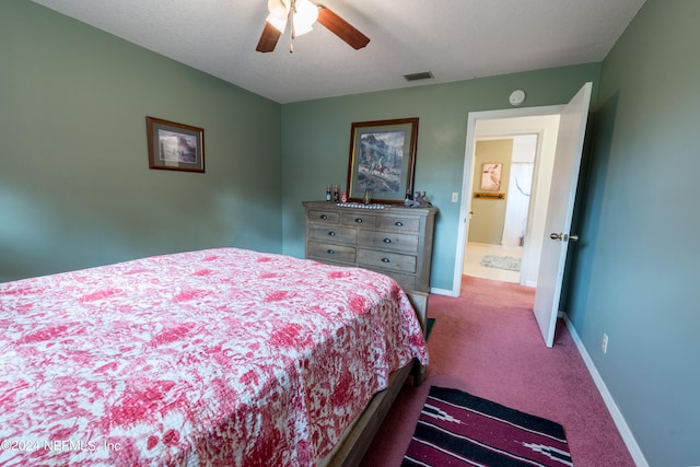 bedroom featuring carpet, ceiling fan, and a textured ceiling