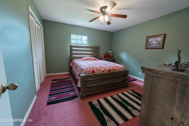 carpeted bedroom with a closet and ceiling fan