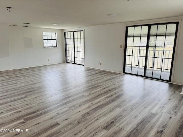 spare room featuring light hardwood / wood-style floors