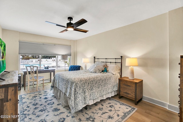 bedroom featuring ceiling fan and hardwood / wood-style floors