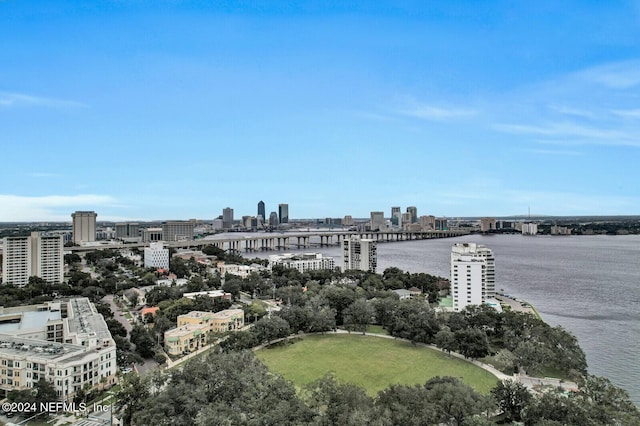 birds eye view of property featuring a city view and a water view