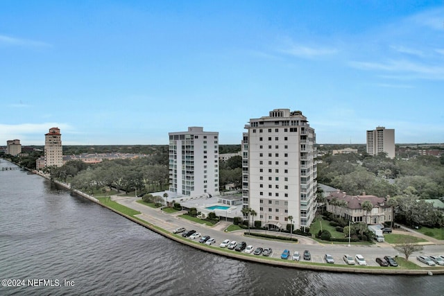 birds eye view of property with a water view