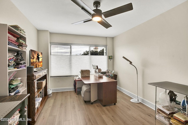 home office featuring a ceiling fan, baseboards, and light wood-style flooring