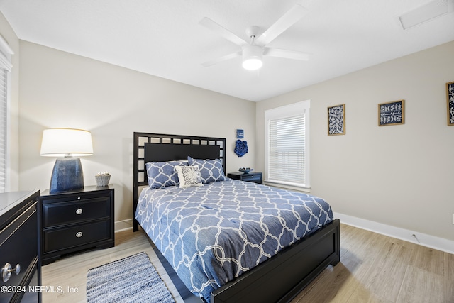 bedroom with light wood-type flooring and ceiling fan