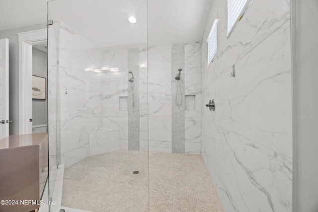 bathroom featuring a tile shower