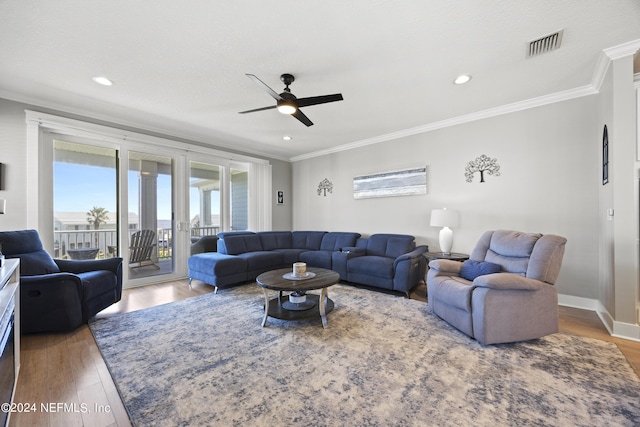 living room with french doors, ornamental molding, hardwood / wood-style flooring, and ceiling fan