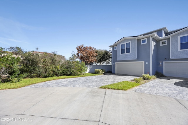 view of side of home with a garage