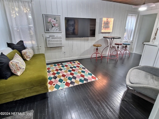 living room featuring dark wood-type flooring and cooling unit