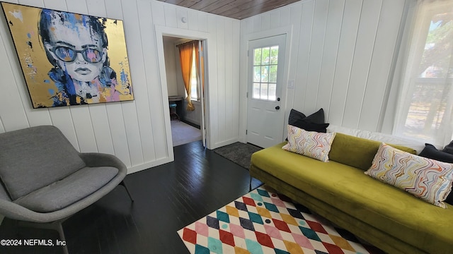 living room featuring wood ceiling, wood walls, and dark hardwood / wood-style floors