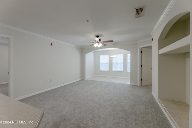 carpeted spare room with ornamental molding and ceiling fan with notable chandelier