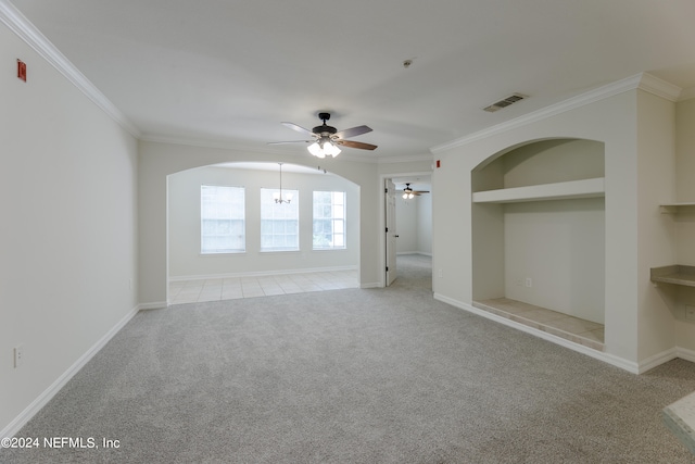 carpeted empty room featuring crown molding and ceiling fan