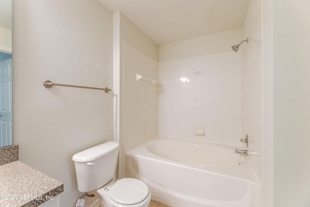 full bathroom with vanity, toilet, and tiled shower / bath