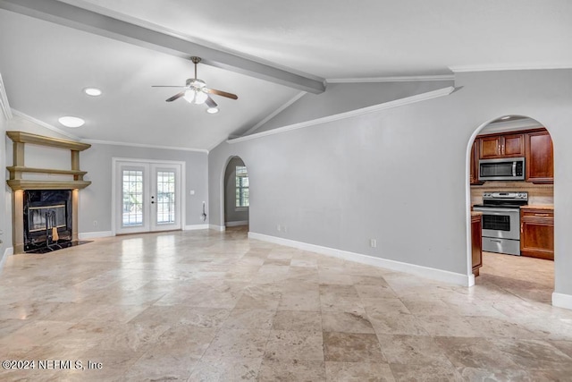 unfurnished living room with french doors, vaulted ceiling with beams, crown molding, a fireplace, and ceiling fan