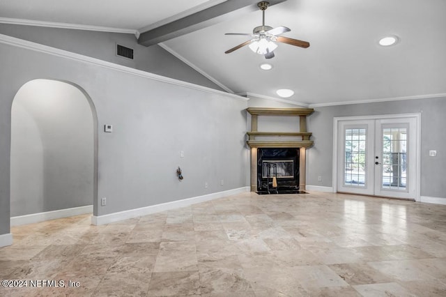 unfurnished living room featuring french doors, ornamental molding, a high end fireplace, lofted ceiling with beams, and ceiling fan