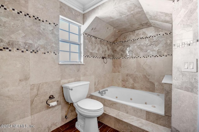 bathroom featuring toilet, wood-type flooring, tiled tub, crown molding, and tile walls