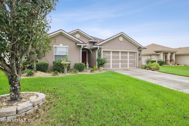 ranch-style home featuring a front yard and a garage