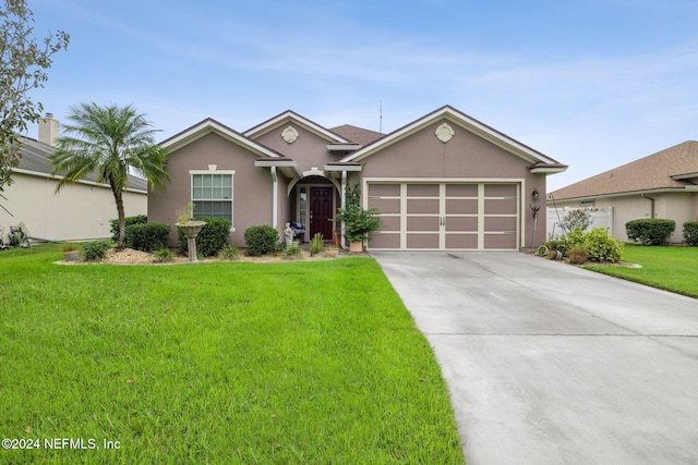 ranch-style home with a garage and a front lawn