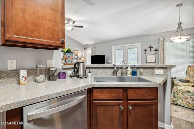 kitchen featuring lofted ceiling, kitchen peninsula, sink, stainless steel dishwasher, and ceiling fan