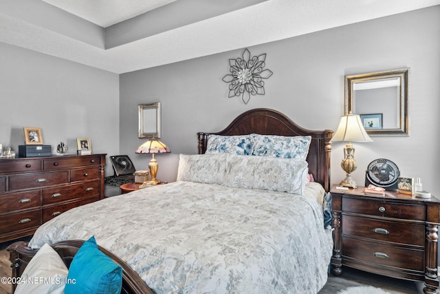 bedroom featuring dark hardwood / wood-style flooring