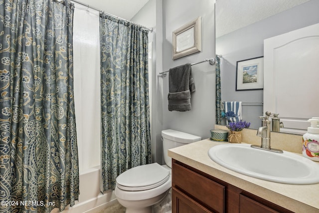 full bathroom with vanity, toilet, shower / bath combination with curtain, and a textured ceiling